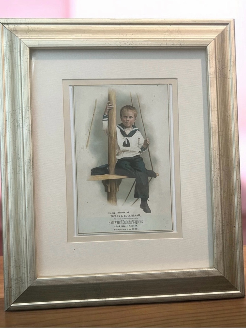 Vintage 1900, 1910 Hand-colored photograph of a boy sailor, a promotional item.